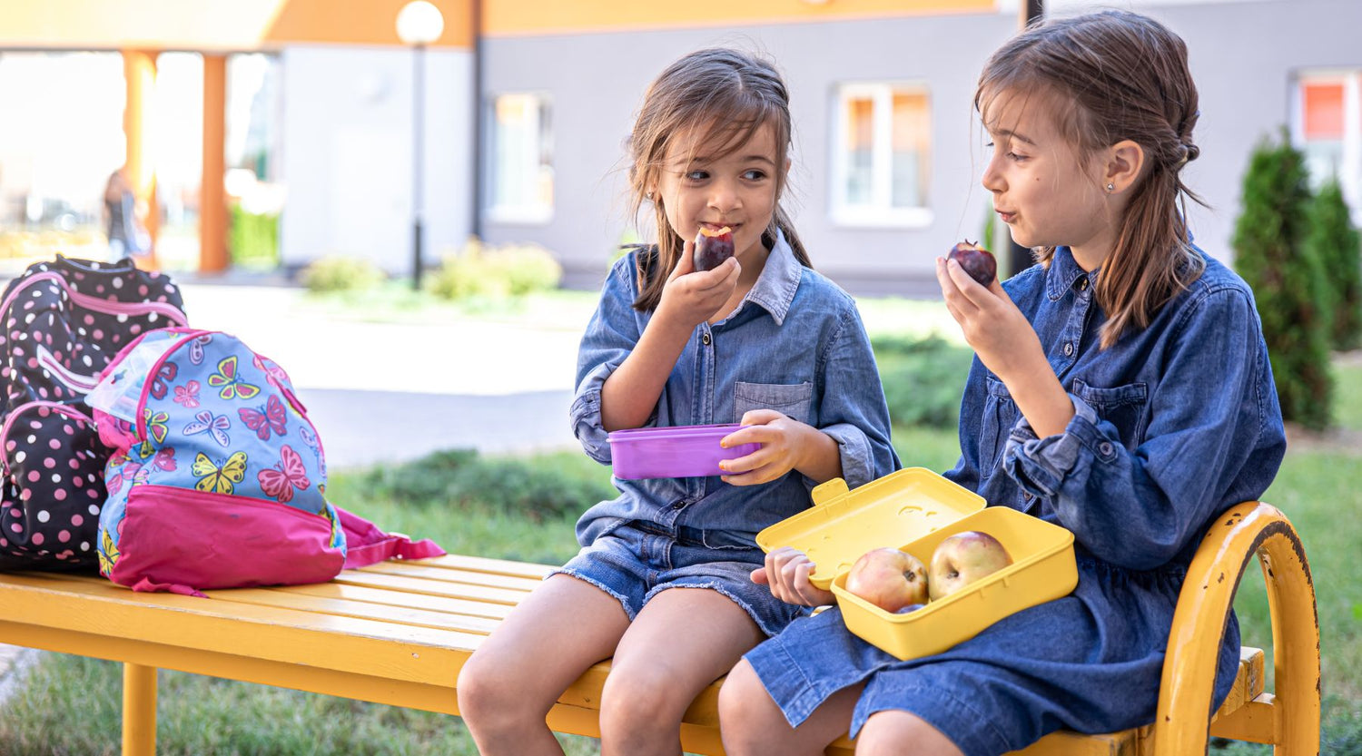 kids enjoying their food in lunchboxes