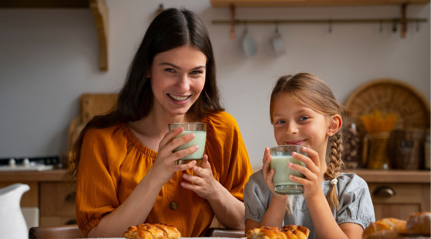 mother daughter drinking pediasure milk and whole milk