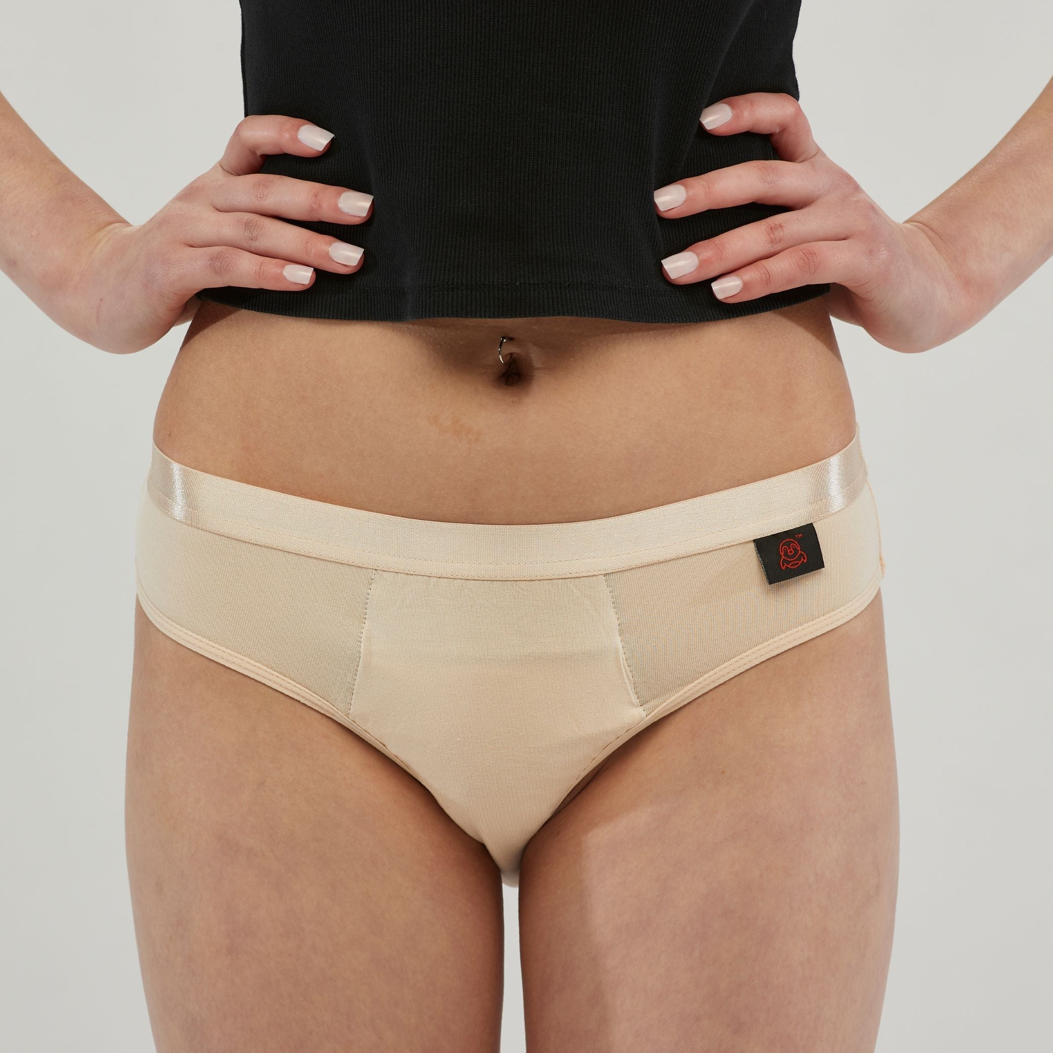 Close-up of beige waterproof incontinence hipster underwear for women, featuring a sleek satin waistband and a discreet, leak-proof design for confidence and comfort.
