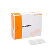 Smith & Nephew Leukostrip Wound Closure Strips retail box on a gray background, with a sheet of adhesive strips lying in front of the box.
