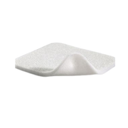 Close-up view of the white Mepilex foam dressing pad revealing the soft silicone layer and "Safetac Technology" label.