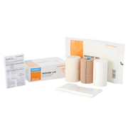 The complete PROFORE Lite multi-layer compression bandage kit with retail box, instructions, and sterile wrapped components.